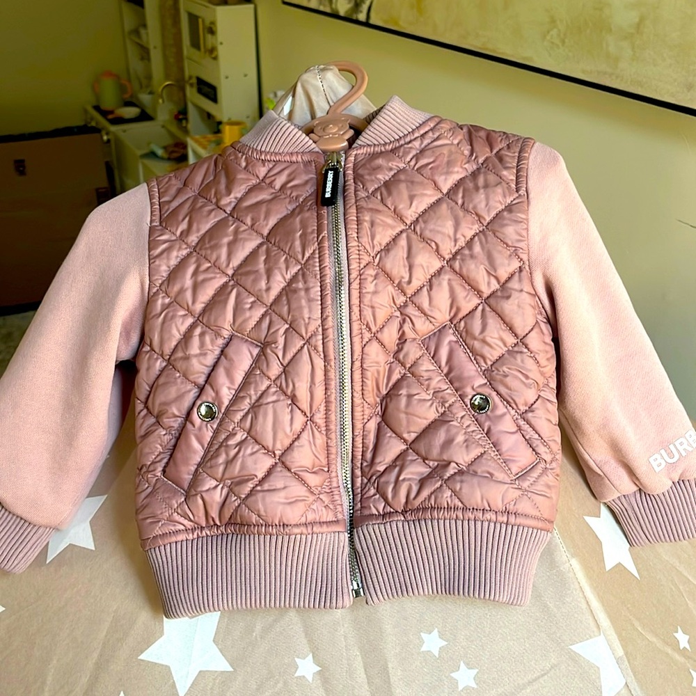 Burberry Pale pink quiltted Jacket with fleece sleeves. Size 18 months.